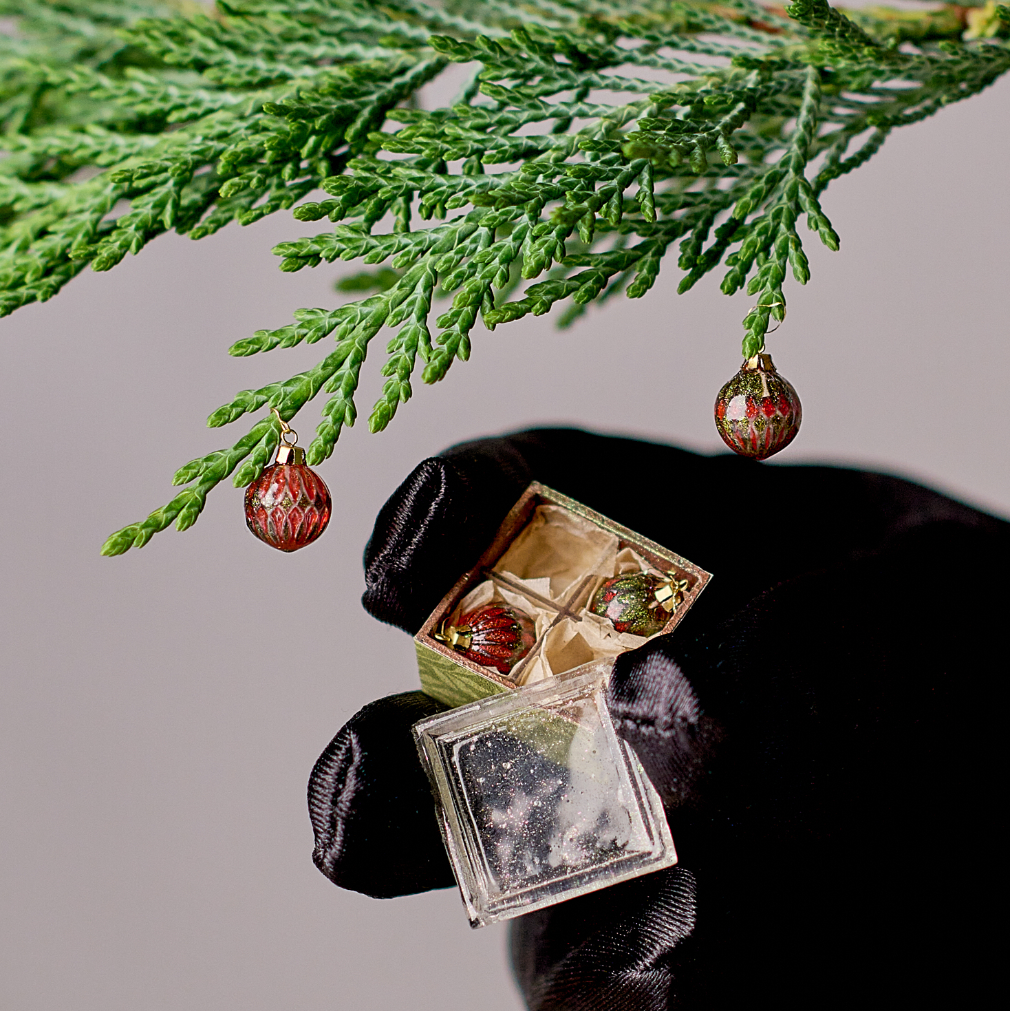 Christmas ornaments set in the box. Harlequin red and green 4 ornaments.