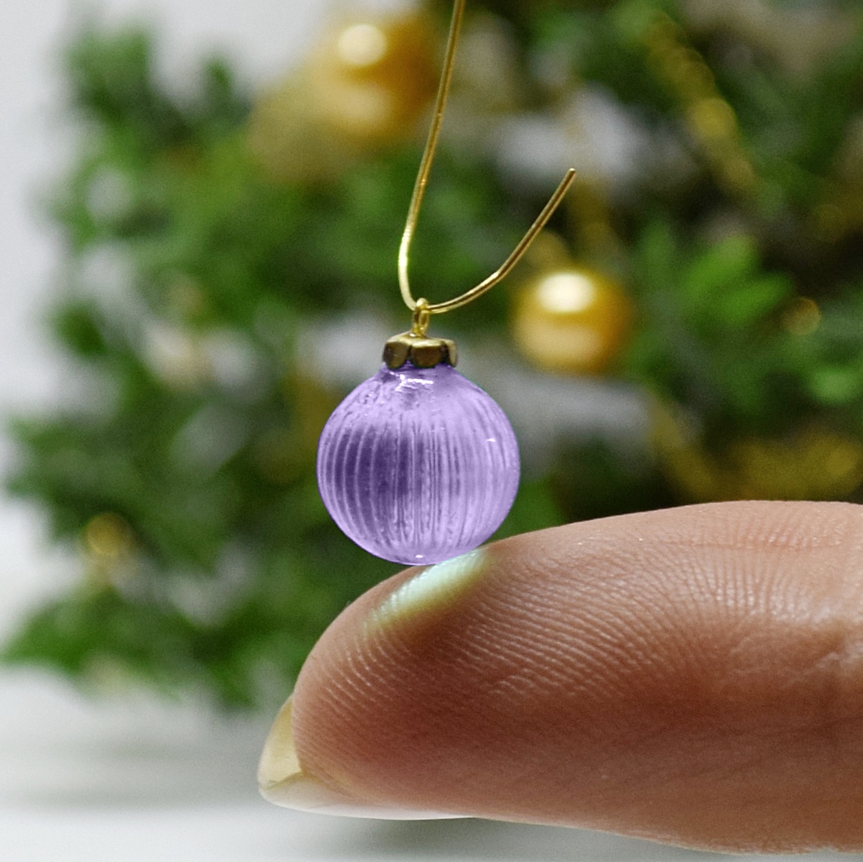 Xmas ornament. Painted. Bauble patterned purple.