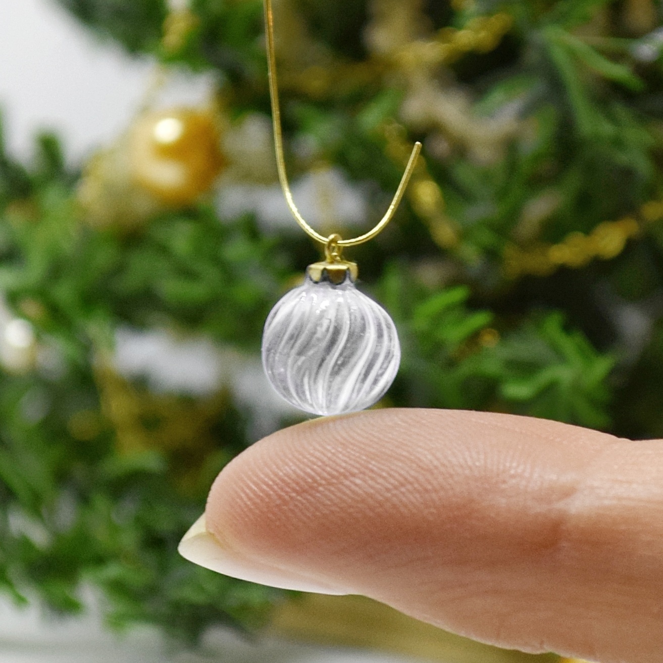 Xmas ornament. Painted. Bauble twisted clear.